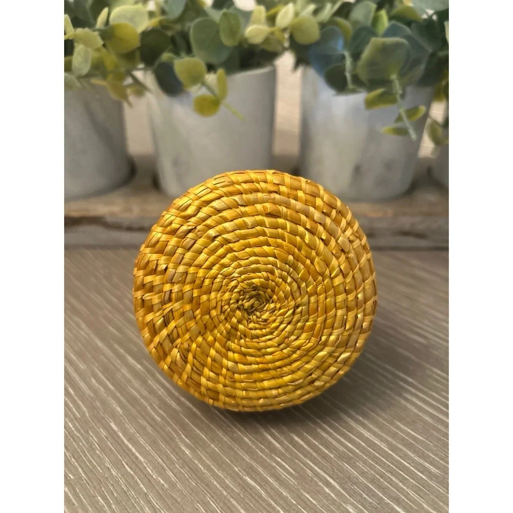 vintage-style coiled‎ basket with a lid
